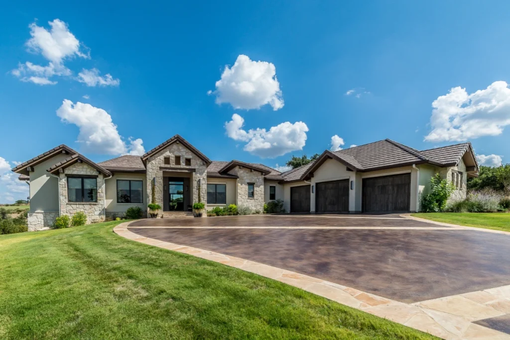 a beautiful stamped concrete driveway in front of a custom home that was installed by a concrete contractor in roseville california