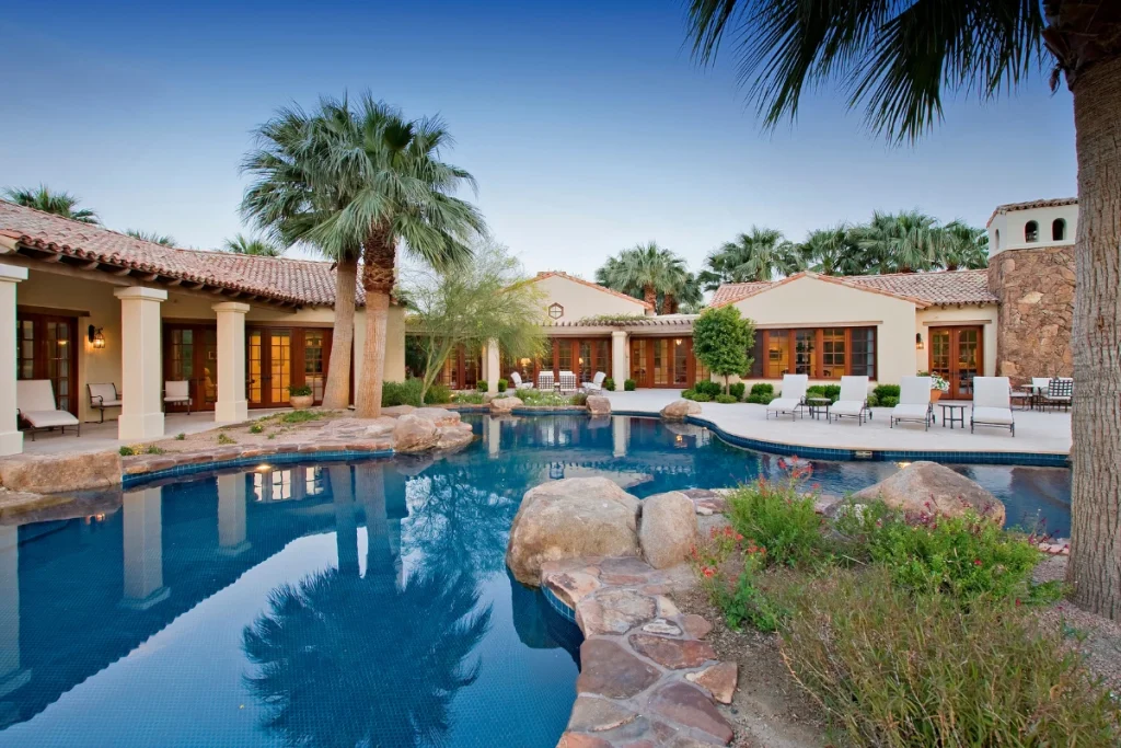 beautiful custom home with tile roof and outdoor pool built by a home builder in roseville