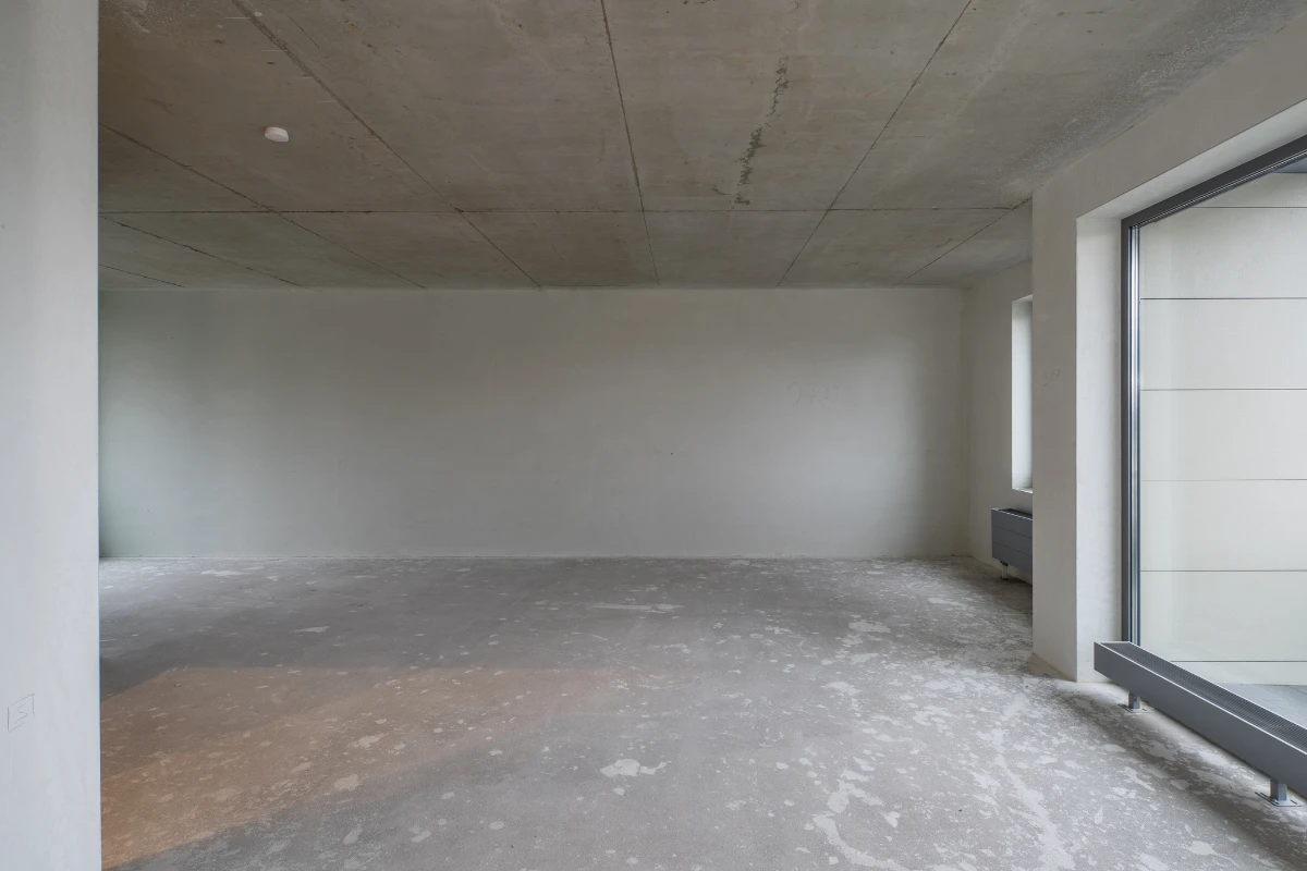a tenant improvement renovation project on progress that shows an apartment with just drywall